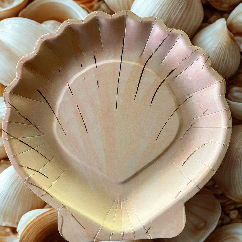 paper clam shell party plate on bed of shells