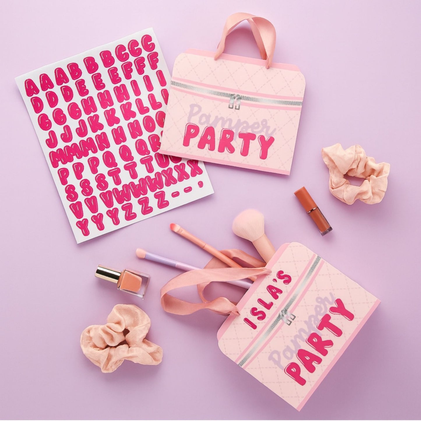Pink party-themed bags including sticker letters for personalisation and pink ribbon handles