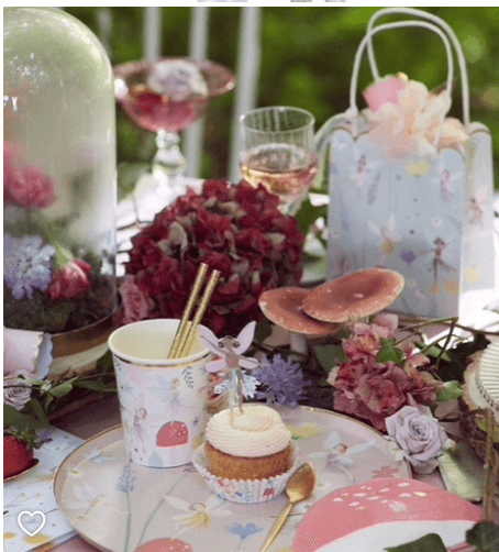 Fairy Tablescape With Meri Meri Plates, Cups & Cupcake Holders. Also includes flowers.
