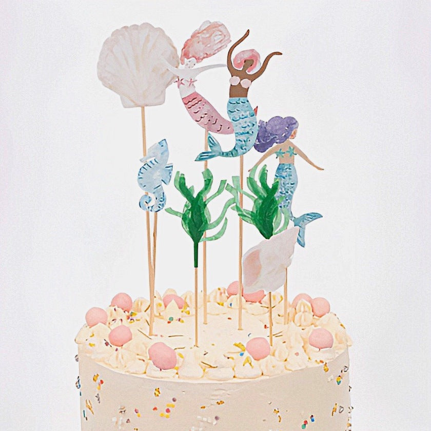 Stunning Mermaid cake toppers in 7 different designs. Mermaids, shells, seaweed and seahorse in pastel colours