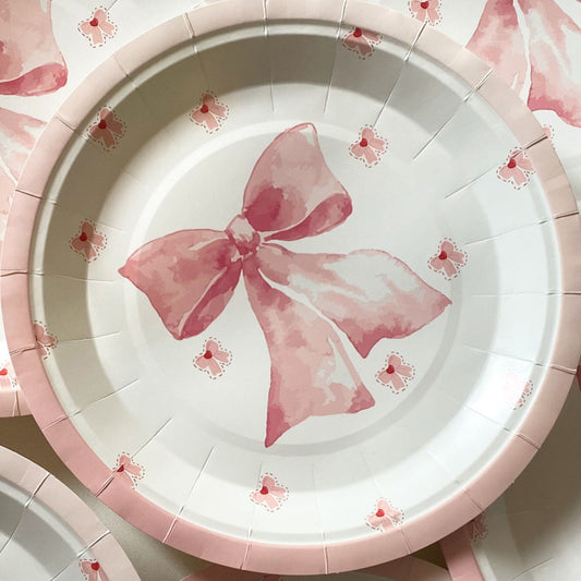 Gorgeous Pink & white paper plates with large pink bow in centre and little pink bows on white background. 23cm