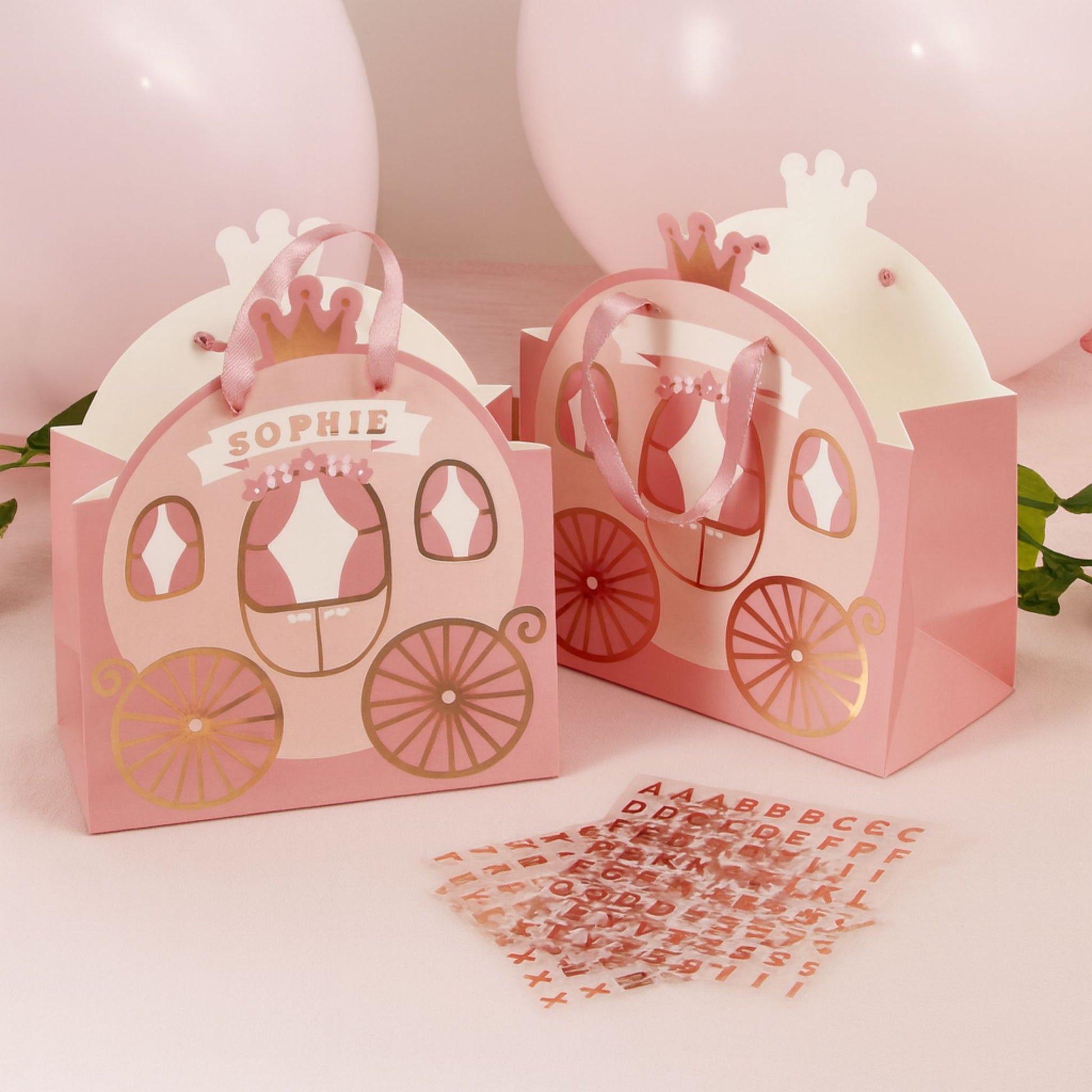 Pink princess party bags in shape of princess carriage with pink handles