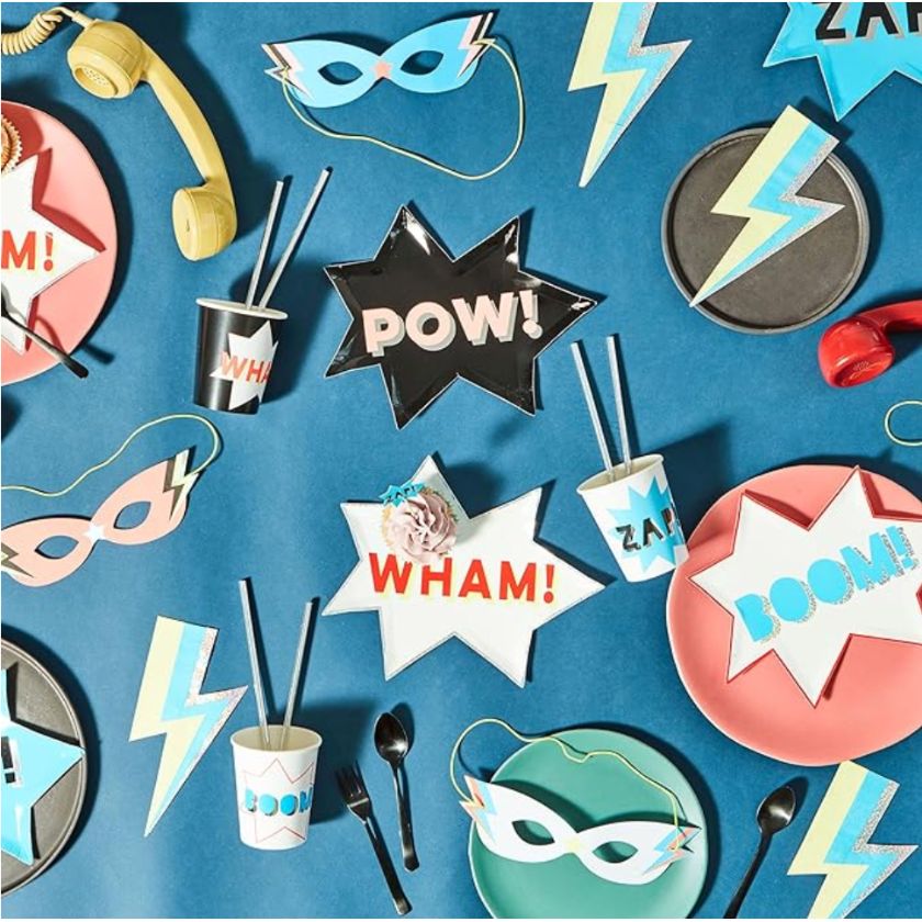 Great Super Hero tableware displayed on table with super hero plates, cups masks and lightning bolt plates