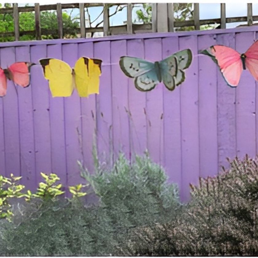 Gorgeous Butterfly Garland by Talking Tables in Garden Setting
